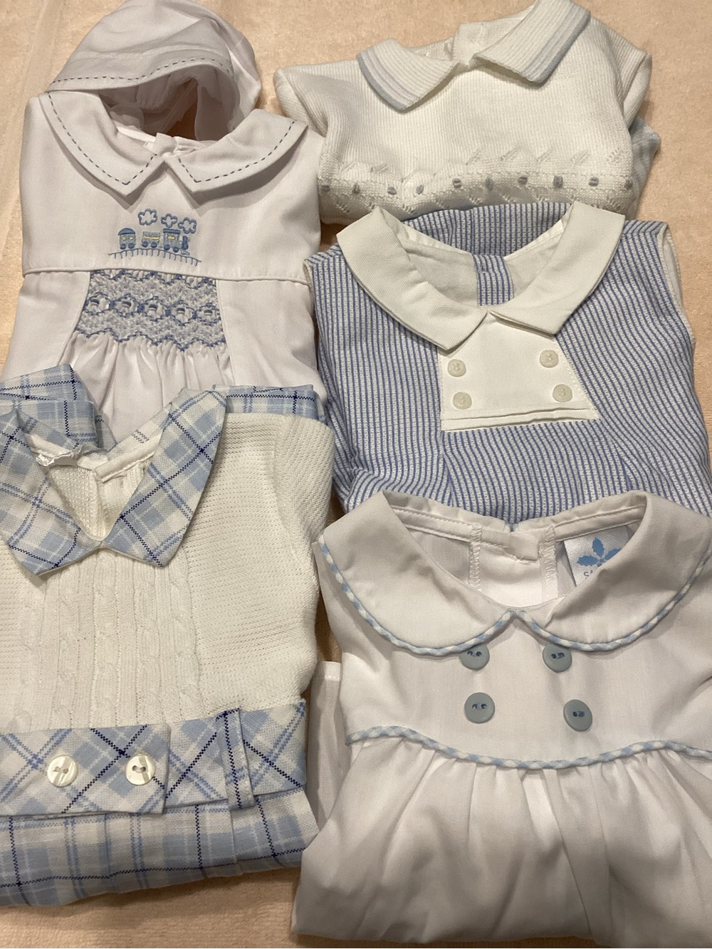 Baby outfits in blue and white. 5 outfits and 3 pairs of shorts